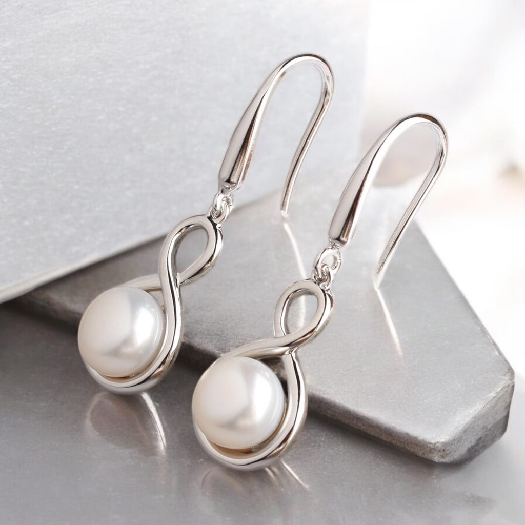 銀繞白珠垂墜耳環 銀繞白珠垂墜耳環